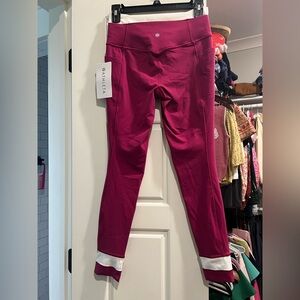 Athleta salutation stash double up tight in wild berry, size small, NWT